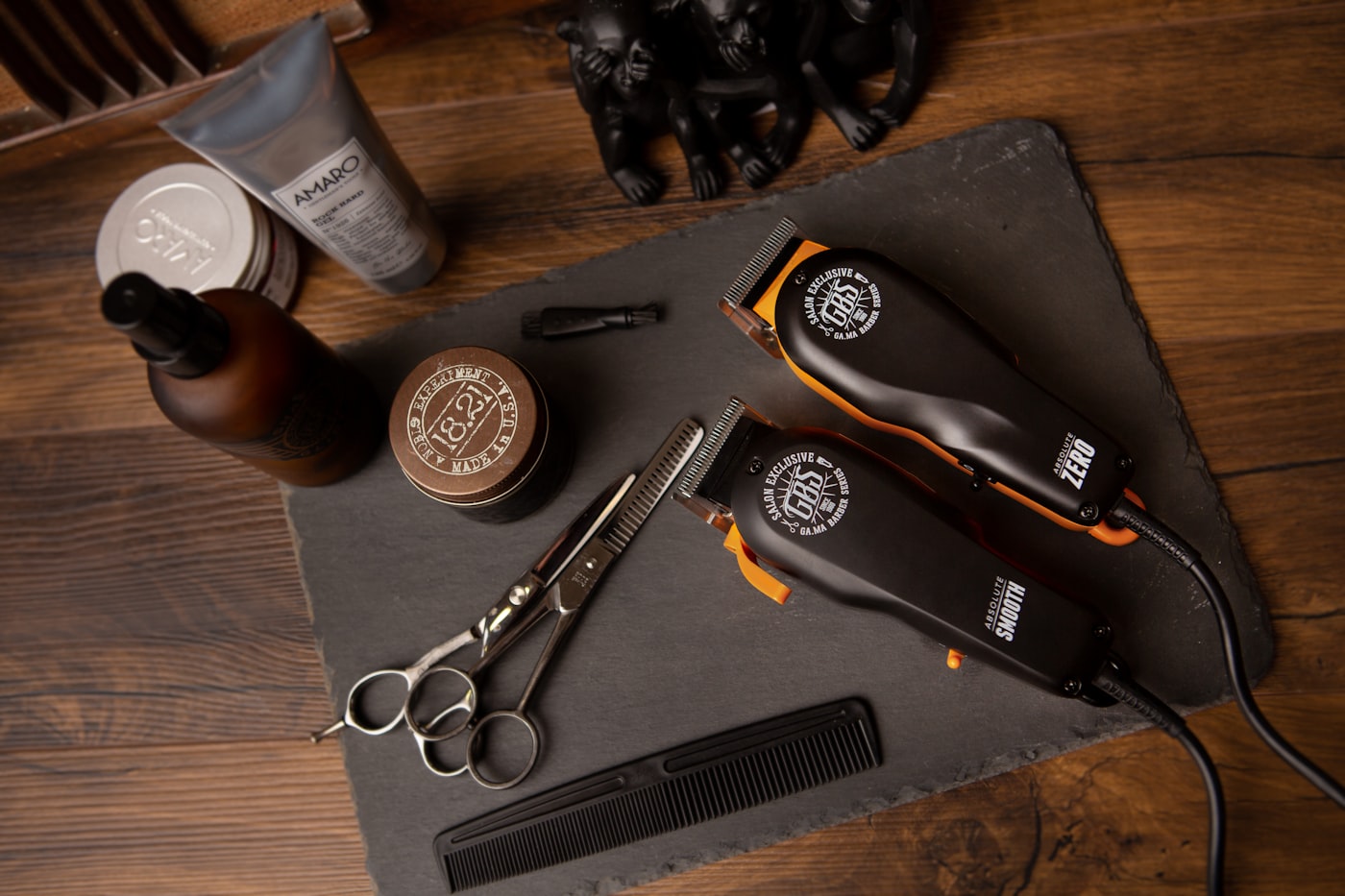 Clippers, scissors and pomade on a barber station