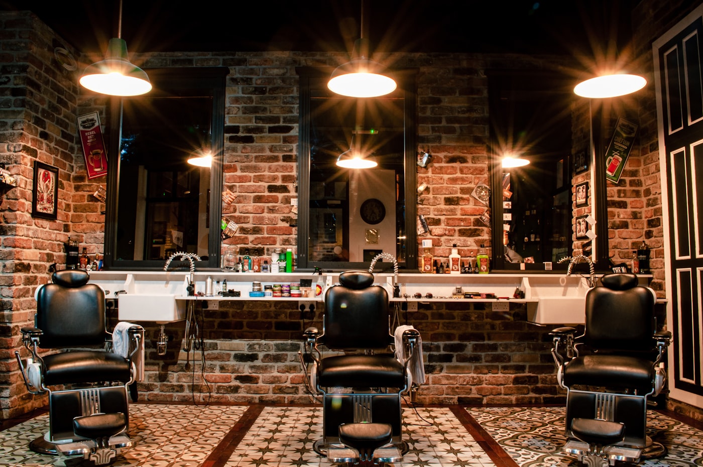 Vintage barber chairs in a brick-walled barbershop